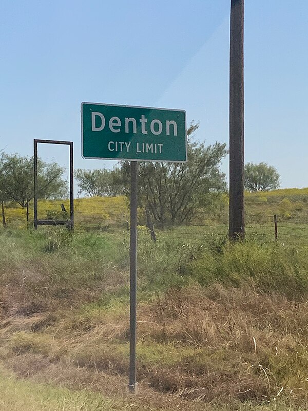 City limit sign welcoming visitors to Denton, Texas