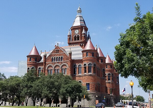 Dallas County Courthouse with Texas flag in Dallas, Texas